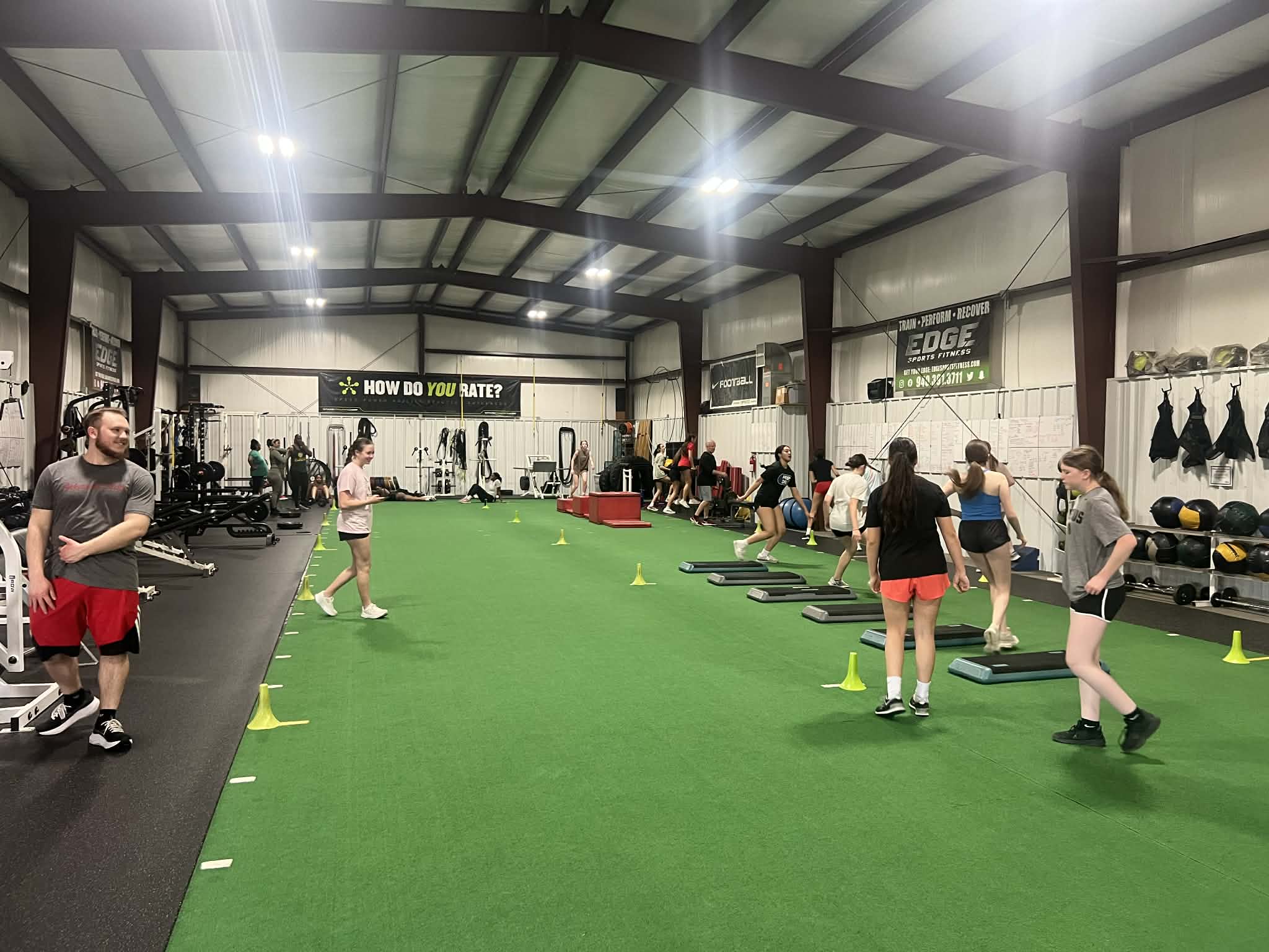 Young athletes training on indoor turf at the Edmond sports facility REVIVE partners with