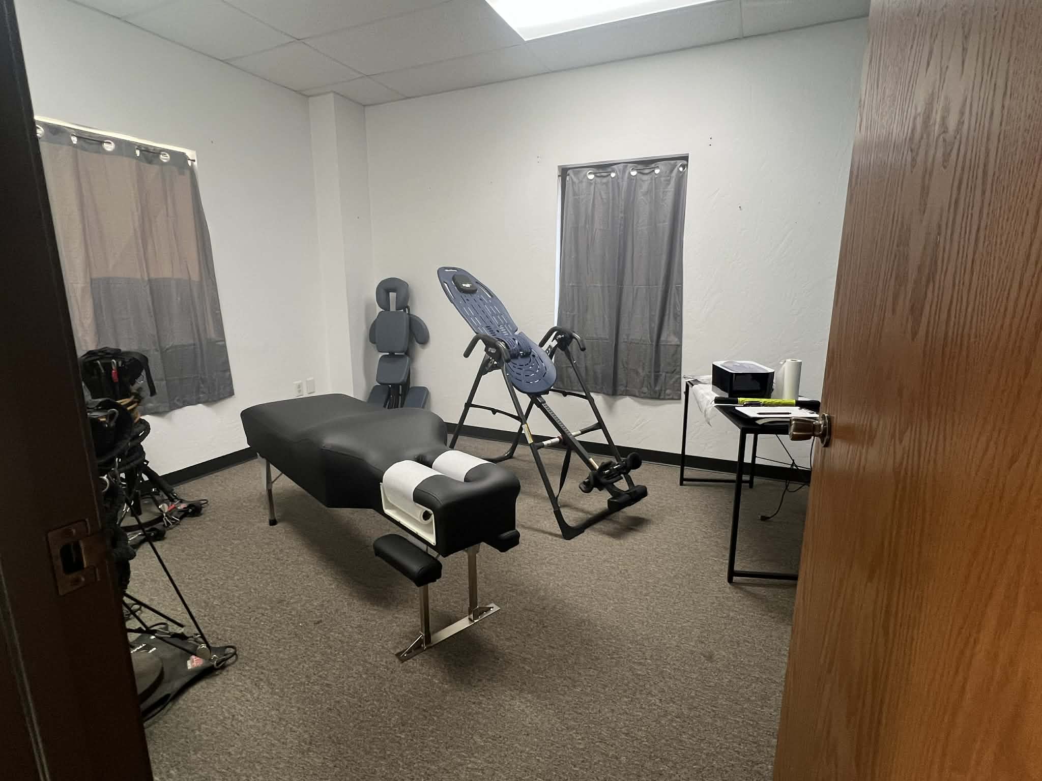 On-site treatment room with a chiropractic adjustment table at the Edmond training facility