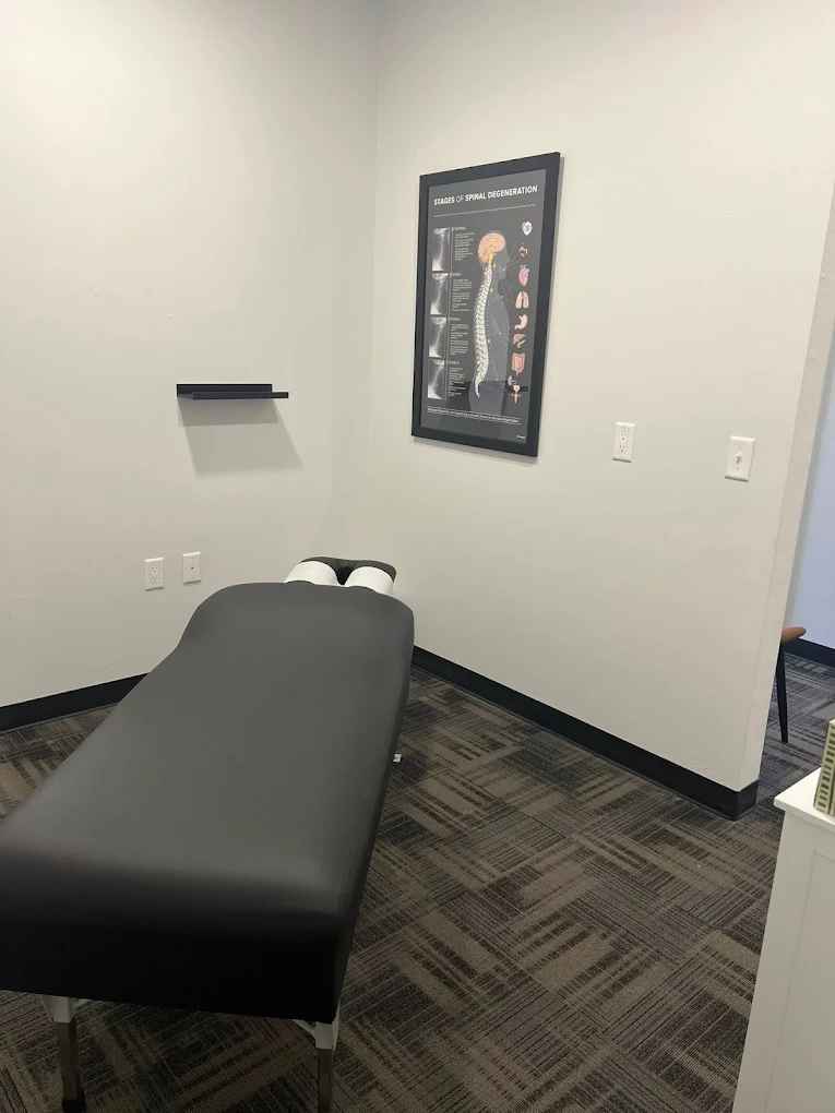 An adjustment table with pregnancy-support pillows at REVIVE